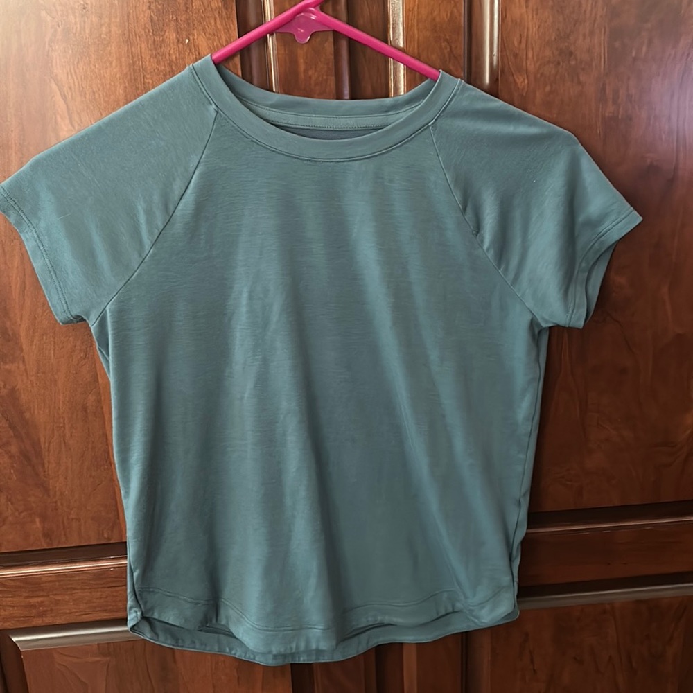 Bundle of 4 Athleta girls size Medium 8-10 tops.